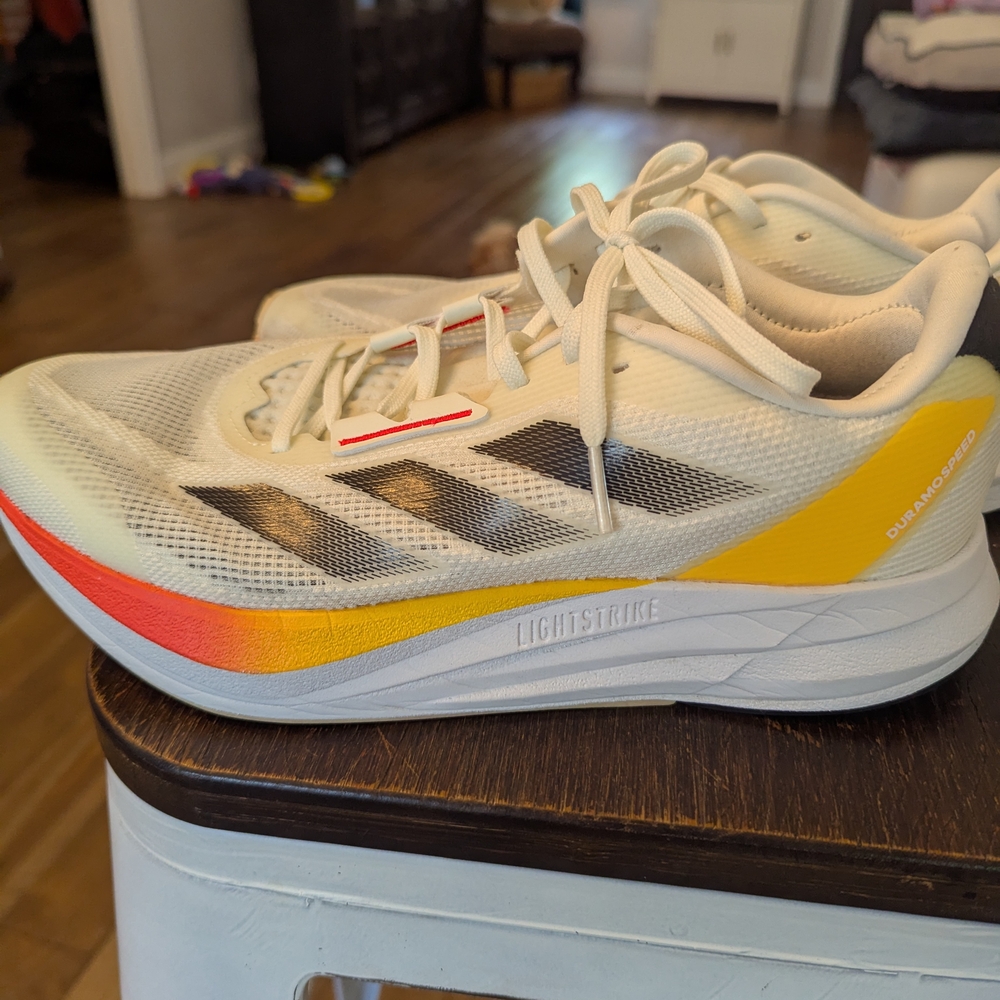 Adidas White Sneakers with Red and Yellow Highlights